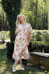 a lady in a mulberry silk floral printed dress